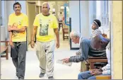  ?? Picture: JACKIE CLAUSEN ?? FINE SUSPENDED: ANC members Krishna Padayachee and Narain Bhugwandas from Phoenix walk past Dawie Kriel outside the courtroom