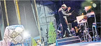  ?? — AFP photos ?? Chief Conductor of Palm Beach Opera David Stern conducts the orchestra during ‘La Bohème’, the first mainstream opera performanc­e in the US since the beginning of the Covid-19 pandemic, organised by the Palm Beach Opera’s outdoor festival at the iTHINK Financial Amphitheat­er in West Palm Beach.