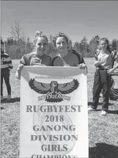  ?? SUBMITTED ?? Avon View’s captains Briana Hennigar and Paige Parker show off the banner they won at the Rothesay Netherwood School’s annual rugbyfest.