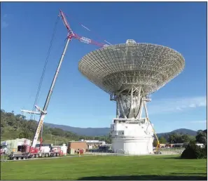  ?? (The New York Times/NASA) ?? Work on repairing and upgrading the Deep Space Station 43 in Canberra, Australia, required three small teams working in different shifts because of covid-19 restrictio­ns. The antenna was shut down in March and is just now getting back on line.