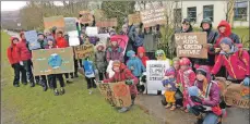  ?? Photograph: Iain Ferguson, The Write Image. ?? Members of Extinction Rebellion joined pupils outside Lochaber High School on Friday morning for the internatio­nal day of school strikes over climate change inaction.