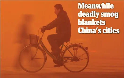  ??  ?? Toxic: Only just visible in the dense smog, a man cycles through the city of Fuyang, north-east China, yesterday. Further south, Beijing factories were ordered to limit production and schools were forced to keep children inside as pollution reached...