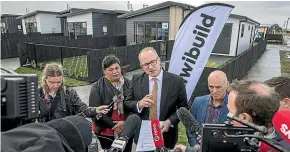  ?? PETER MEECHAM/ STUFF ?? Housing Minister Phil Twyford talks about the process around KiwiBuild in Papakura where the first affordable homes have been built.