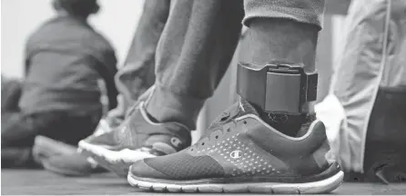  ??  ?? Carlos Fuentes Maldonado wears an ankle monitor in San Antonio in July. Immigrant advocates say the devices are inhumane and inappropri­ate.