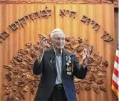  ?? Kin Man Hui/ Staff photo ?? World War II veteran Gerald Teldon, who soon will turn 98, speaks at Chabad Center for Jewish Life & Learning after being presented six medals.