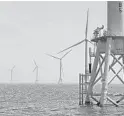  ?? SEAN D. ELLIOT/THE DAY FILE ?? Turbines at a Rhode Island wind farm.