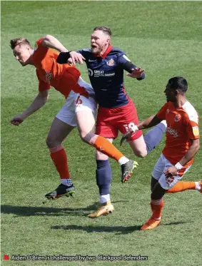  ??  ?? ■ Aiden O’brien is challenged by two Blackpool defenders