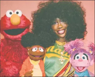  ?? ?? SZA finds her way to “Sesame Street” and pals around with Elmo (from left), Gabrielle and Abby.