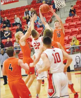  ?? Westside Eagle Observer/MIKE ECKELS ?? Triston Batie (Lions 15) takes away a rebound from Jackson Mckinley (Cardinals 22) during the first quarter of the Farmington-Gravette boys’ basketball contest at Cardinal Arena in Farmington Feb. 1. The Lions claimed the victory, 55-44.