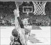  ?? Wally Skalij
Los Angeles Times ?? THE CLIPPERS’ Blake Griffin gets a shot off over San Antonio’s Tiago Splitter during Game 1.