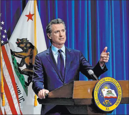  ?? Rich Pedroncell­i The Associated Press ?? Gov. Gavin Newsom speaks about his 2021-22 state budget proposal in Sacramento, Calif., in January.