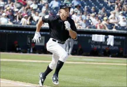 ?? LYNNE SLADKY — THE ASSOCIATED PRESS ?? Yankees designated hitter Aaron Judge runs to first on ground out to third during spring training game against Tigers, Wednesday in Tampa, Fla.