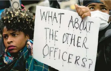  ?? GERALD HERBERT/AP ?? Protesters march Saturday in Memphis, Tenn., over the death of Tyre Nichols in police custody Jan. 7.