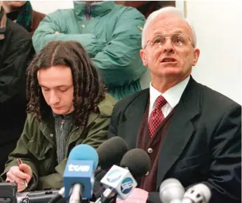  ?? AP FILES ?? Adem Demaci, right, the political representa­tive of the Kosovo Liberation Army, talks to the media during a news conference in 1999. Demaci, often called the “Balkans’ Mandela,” has died at 82.