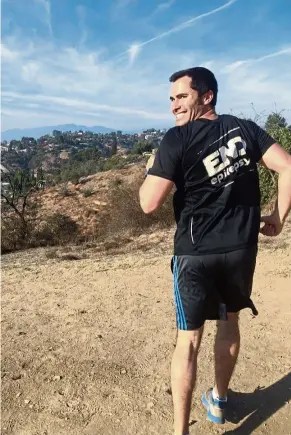  ??  ?? Movie production lawyer Loren Zitomersky practises running backward in the San Rafael Hills of north-east Los Angeles. Zitomersky, 33, has embarked on a singular, if odd, quest: At the 2018 Boston Marathon, he’ll attempt to break the world record for...