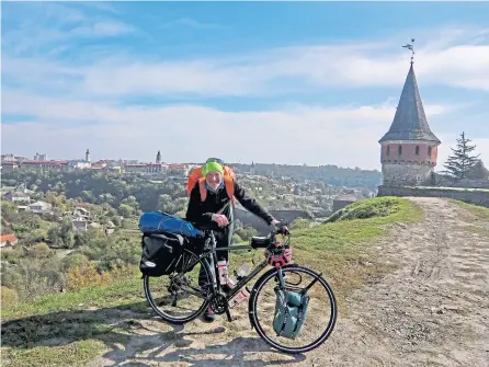  ??  ?? Out for a spin – Alastair on his travels in Kamianets-Podilskyi, Ukraine, 2017