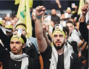  ?? (Aziz Taher/Reuters) ?? HEZBOLLAH SUPPORTERS chant slogans during a rally in Beirut marking the annual anti-Israel Al-Quds Day last month.