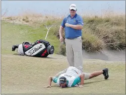  ?? — THE ASSOCIATED PRESS FILES ?? Canadian Brad Fritsch watches as his caddy lines up a putt on the 15th hole on Thursday.