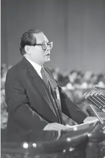  ?? ?? Jiang Zemin addresses the 14th National Congress of the Communist Party of China during the opening ceremony at the Great Hall of the People in Beijing on October 12, 1992.