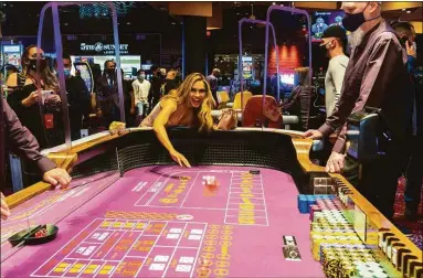  ?? File press photo via Mohegan Gaming & Entertainm­ent ?? The Mohegan Sun Casino at Virgin Hotels Las Vegas at its March 2022 opening. The CEO of Mohegan Gaming & Entertainm­ent said the resort operator has seen a drop in volumes at its gaming tables as a result of discontinu­ing regular bus service from New York City and Boston, but with no impact on profits having eliminated the cost of running the shuttles.