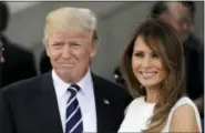  ?? AP PHOTO/MARKUS SCHREIBER ?? In this July 7, 2017 photo, President Donald Trump, left, and first lady Melania Trump smile prior to a concert on the first day of the G-20 summit in Hamburg, northern Germany. The White House has announced that President Trump and the first lady have...