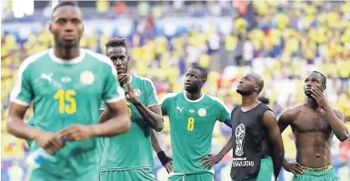  ?? AP ?? Senegal’s players leave the field after the Group H match between Senegal and Colombia at the 2018 soccer World Cup at the Samara Arena in Samara, Russia, yesterday.