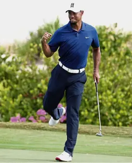  ??  ?? Major attraction: Tiger Woods reacting after saving par on the 16th hole during the second round of the Hero World Challenge in Bahamas last year.