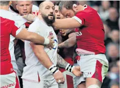  ??  ?? Below the belt: England’s Joe Marler appears to squeeze the genitals of Alun Wyn Jones