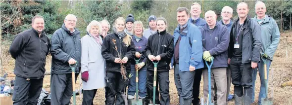  ??  ?? Pictured are councillor­s and Charnwood Borough Council officers with Loughborou­gh Green Gym volunteers in the Outwoods.