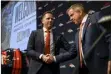  ?? AARON ONTIVEROZ — THE DENVER POST ?? Broncos head coach Sean Payton, right, shakes hands with general manager George Paton during an introducto­ry press conference at team headquarte­rs in Englewood on Monday.