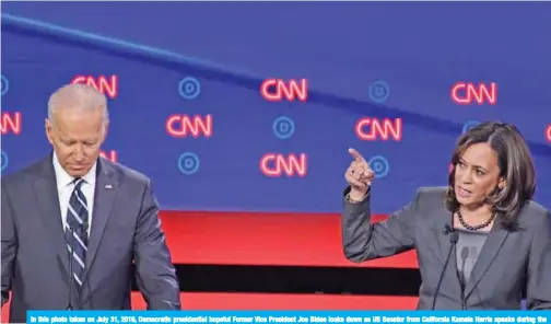  ??  ?? In this photo taken on July 31, 2019, Democratic presidenti­al hopeful Former Vice President Joe Biden looks down as US Senator from California Kamala Harris speaks during the second round of the second Democratic primary debate of the 2020 presidenti­al campaign season hosted by CNN at the Fox Theatre in Detroit. — AFP