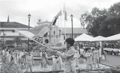  ??  ?? FREEDOM IN THE VISAYAS - A group performs the depiction of the “Cry of Santa Barbara,” the event which led to the first hoisting of the Philippine flag outside of Luzon during the 1898 Philippine Revolution against Spain. On the occasion of the 117th...