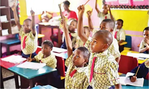  ??  ?? Elementary pupils in a class.