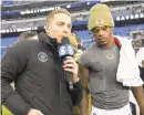  ?? NICKWASS/AP ?? CBS reporter EvanWashbu­rn stands next to Ravens quarterbac­k Lamar Jackson following a victory over the Texans last season.