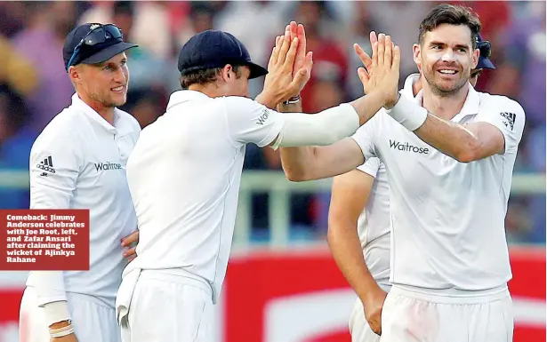  ??  ?? Comeback: Jimmy Anderson celebrates with Joe Root, left, and Zafar Ansari after claiming the wicket of Ajinkya Rahane