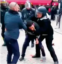  ?? AP ?? A man identified as Alexandre Benalla, a security chief to French President Emmanuel Macron, confrontin­g a student during a May Day demonstrat­ion in Paris.—