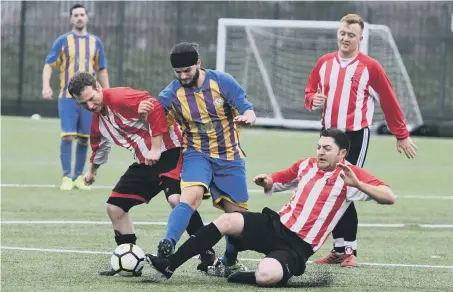  ??  ?? Lakeside (red and white) scrap against Wear United in the Sunderland Sunday League last week. Picture by Kevin Brady.