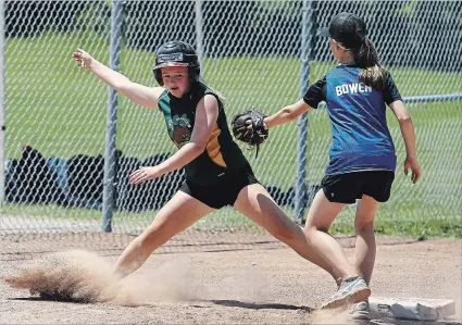  ?? CLIFFORD SKARSTEDT EXAMINER ?? A St. Martin's player is tagged out by an Immaculate Conception player during three-pitch, St. Peter's Family of Schools Senior Tournament action on Tuesday at Bowers Park.