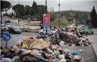 ?? (Hadas Parush/Flash90) ?? PILES OF GARBAGE left by Jerusalem Municipali­ty workers are seen in front of the Finance Ministry and Knesset yesterday.