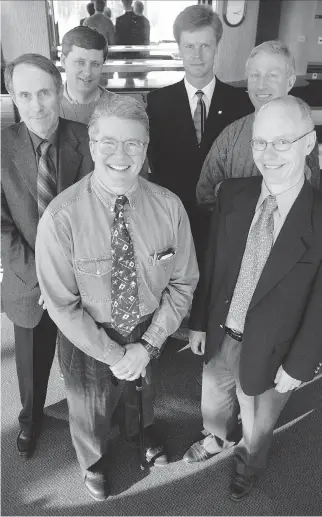  ?? JEFF MCINTOSH FOR THE NATIONAL POST/FILES ?? Authors of the January 2001 open letter — known as the ‘firewall letter’ — to then-Alberta premier Ralph Klein are Andrew Crooks, front left, Rainer Knopff, front right, Tom Flanagan, middle left, Ted Morton, middle right, Stephen Harper, back left, and Ken Boessenkoo­l, back right. They were photograph­ed at the University of Calgary faculty club on Friday, Jan. 26, 2001.