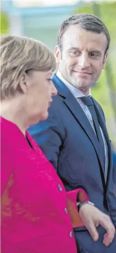  ?? FOTO: DPA ?? Angela Merkel (CDU) und Emmanuel Macron in Berlin: „Das Treffen weckt Hoffnung“, meint Andreas Jung (CDU). Es komme viel auf Frankreich und Deutschlan­d an.