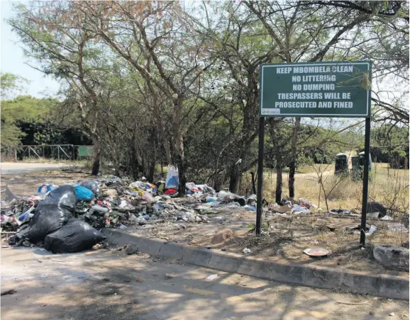  ?? ?? A warning sign next to the illegal dumpsite in Mataffin.