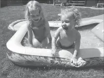  ?? Photo submited by Lethbridge Early Years Coalition ?? River and Slater are having some fun socializin­g and playing in the water together.