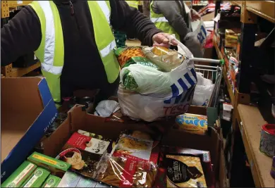  ??  ?? Four foodbanks in Glasgow distribute­d almost 25,000 food parcels last year