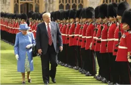 ?? — AP ?? US President Donald Trump and Britain’s Queen Elizabeth II inspect a Guard of Honour, formed of the Coldstream Guards at Windsor Castle in Windsor, England, on Friday.
