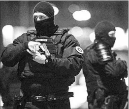  ?? JEAN-FRANCOIS BADIAS/AP ?? Police officers stand guard Thursday, two days after a fatal attack, in Strasbourg, France,