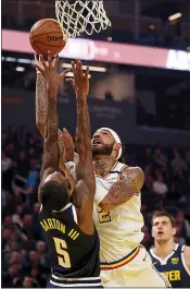  ?? RAY CHAVEZ — STAFF PHOTOGRAPH­ER ?? Willie Cauley-Stein is fouled by the Nuggets’ Will Barton while taking a shot Thursday’s at Chase Center. For a report on Thursday night’s game and more on the Warriors, please go to mercurynew­s.com/sports.