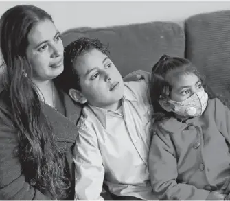  ?? REUTERS ?? Emiliana, 32, poses for a photo with her son, Leonardo, 10, and daughter, Emily, 5, at their apartment in Los Angeles on Monday.