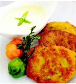  ??  ?? Crispy ackee and saltfish fritters served with Scotch bonnet peppers and thyme remoulade are an absolute treat.