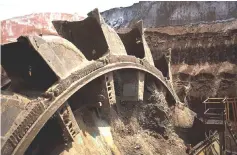  ??  ?? A bucket wheel rotates during mining operations at the Garzweiler open cast lignite mine, operated by RWE, in Garzweiler, Germany, on July 13, 2017.